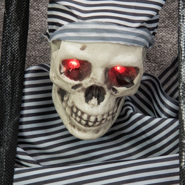 Halloween Figur Knasti - Wand-Dekoration - Totenkopf hinter Gittern - Rot blinkende Augen